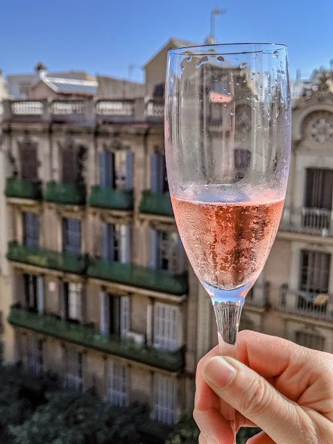 Glass of cava with a view of Barcelona - a perfect welcome to our trip
