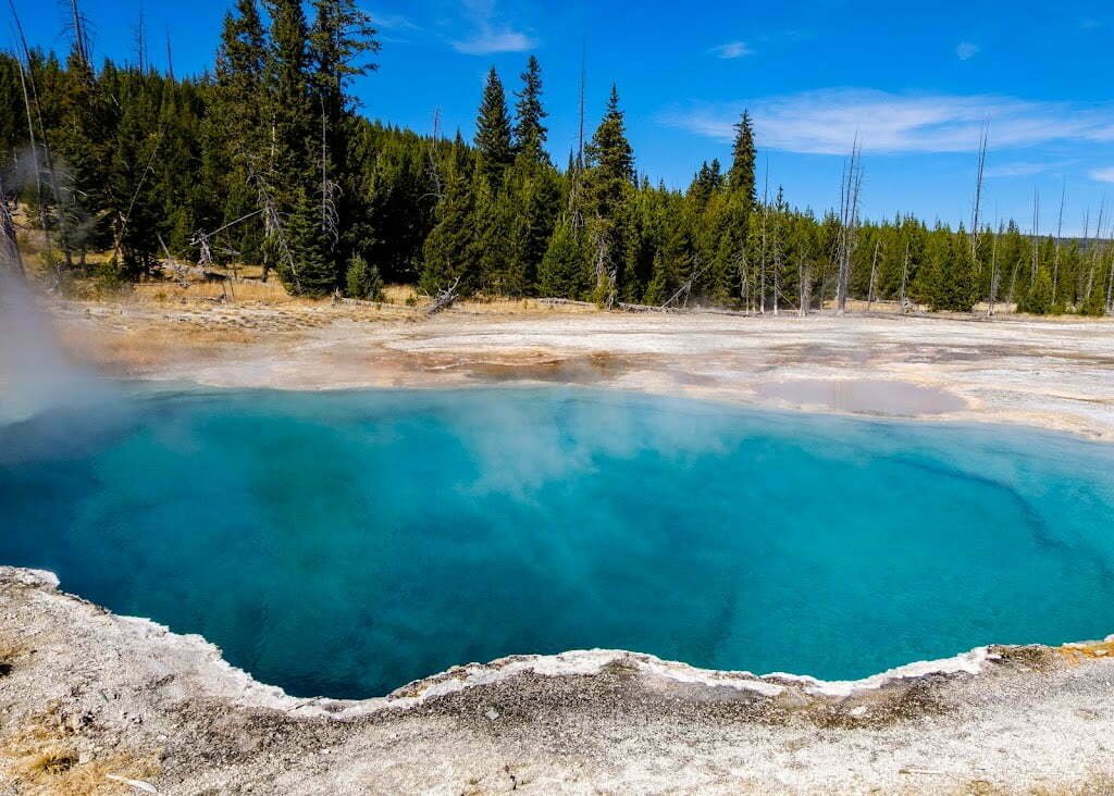Yellowstone itinerary highlights - Bright blue hot spring in Yellowstone's West Thumb Geyser Basin