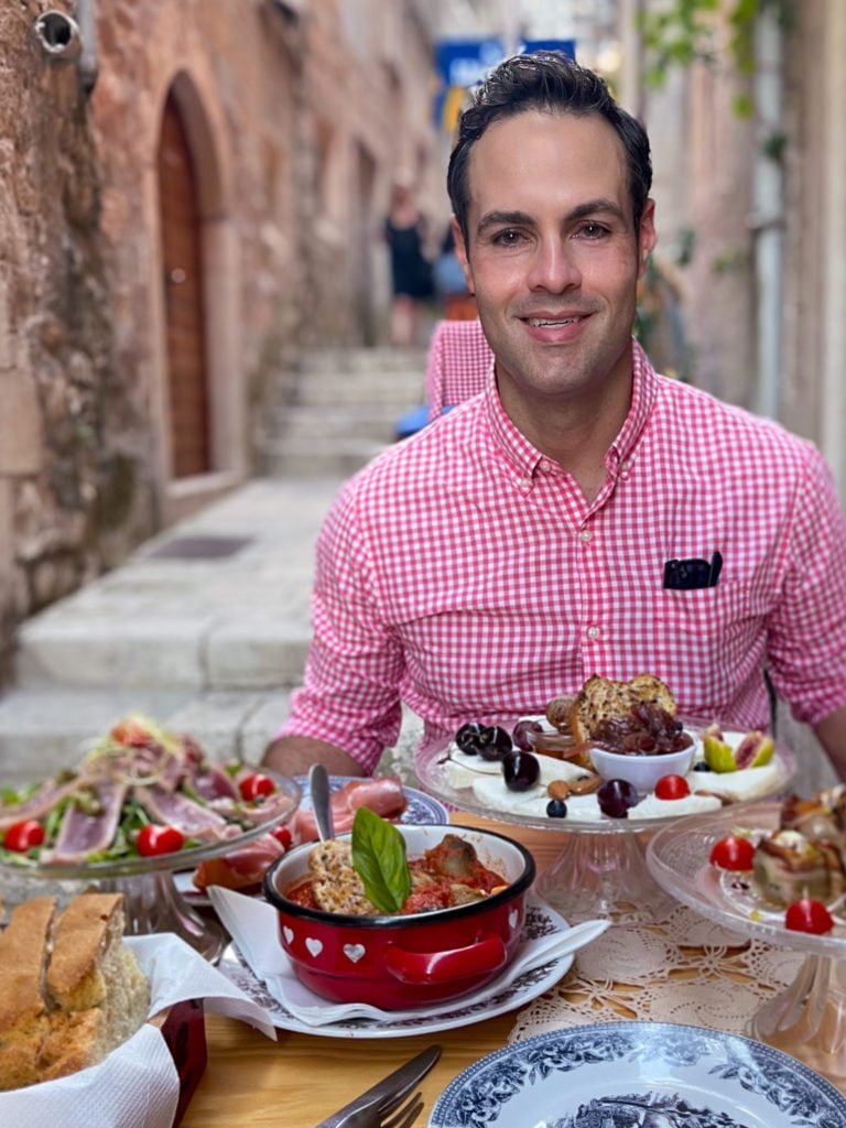 Jeff from Adventurous Tastes dining  at Lole,  a Korcula alleyway restaurant in Croatia