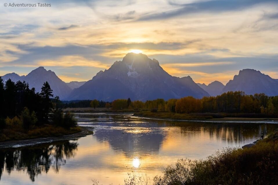 Golden light over mountains and river | photography spots in Yellowstone and Grand Teton