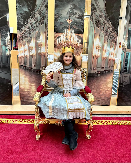 Little girl dressed up in royal costume at Schonbrunn Palace children's museum in Vienna