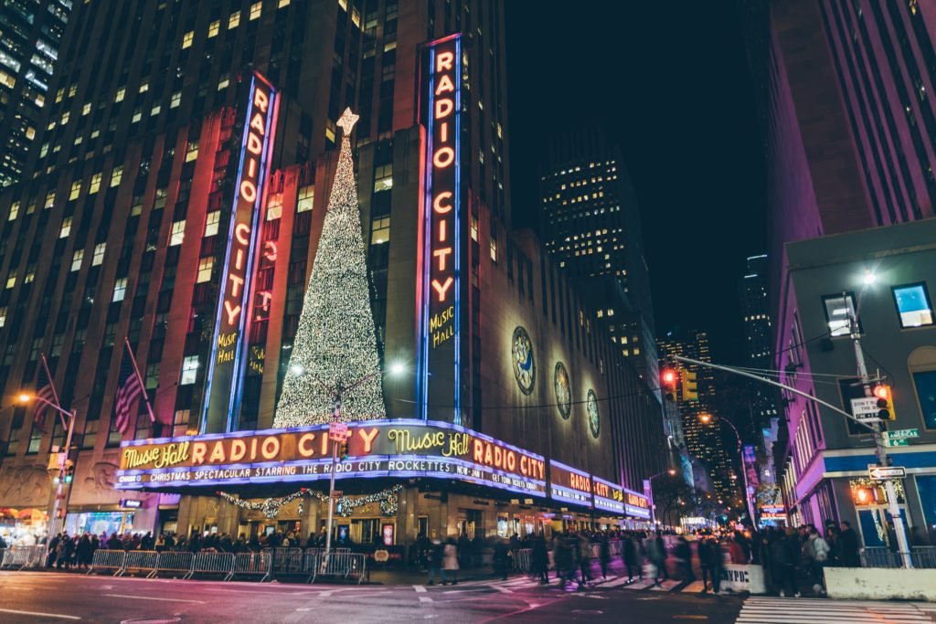 A Rockette's show. atRadio City Music Hall is a must do when visiting NYC at Christmas | Photo by Goh Rhy Yan on Unsplash