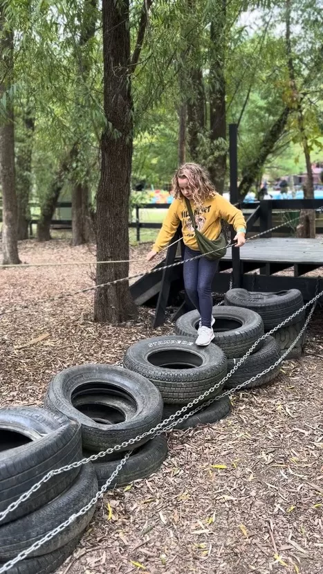 Great Country Farms is one of the best pumpkin patches near DC, complete with an obstacle course this little girl is exploring