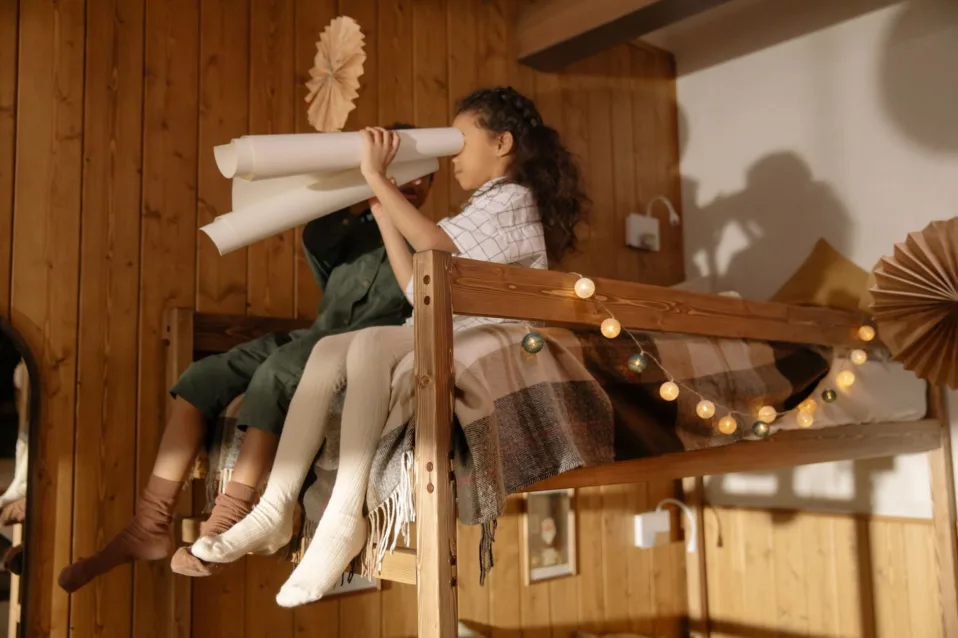 children playing on a bunk bed