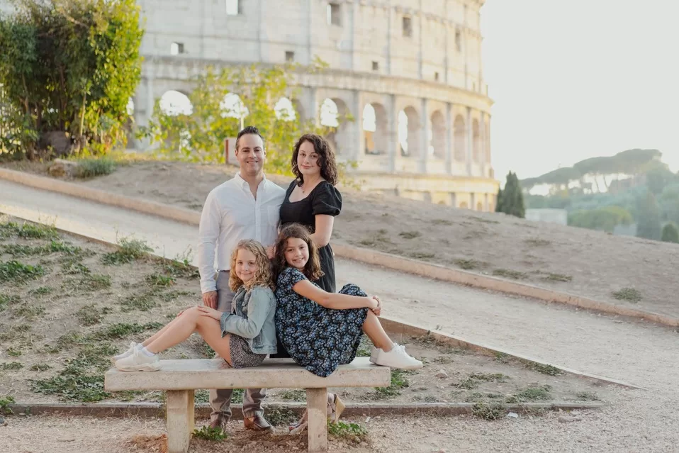 Adventurous Tastes family travel blog | posing in front of the Coliseum while in Rome with kids