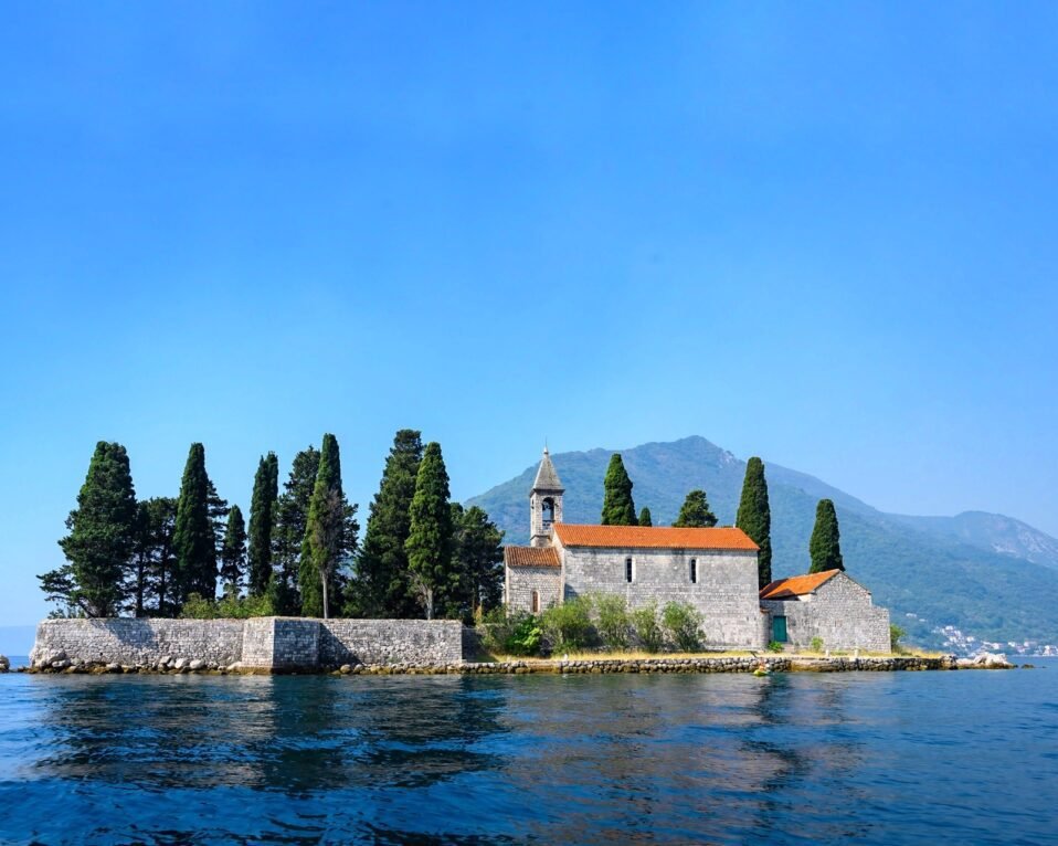 building and trees on a small island in Montenegro