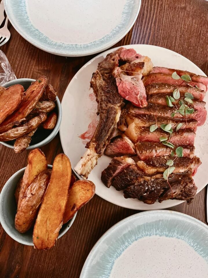 Meat and roasted vegetables at Sunday roast in London