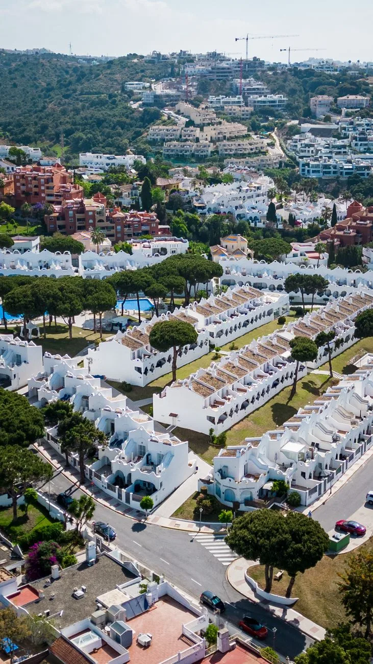 aerial view of whitewashed villas in marbella